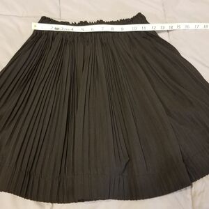 Black pleated circle a line skirt